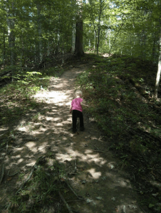 little girl hiking on trail